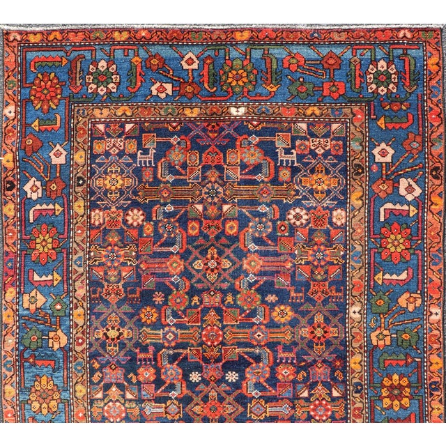 Measures: 4'3" x 6'1" Antique Persian Nahavand Rug with Vivid Geometric Patterns 4'3" x 6'1". Keivan Woven Arts / Rug /...