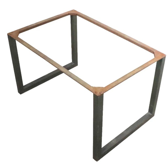 Architectural design, Brutalist style coffee table, having a slate top, with a base constructed of squared brass and iron....