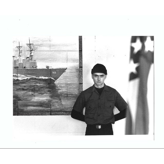 1980 black and white photograph of a Naval recruit at the Naval Station Great Lakes Training Center. Publication...