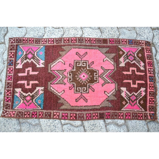 This is a vintage Turkish Oushak rug from the 1960s. The piece was hand-knotted.