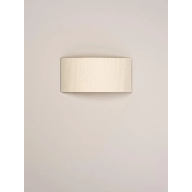Natural comodín rectangular wall lamp by santa & cole dimensions: d 50 x w 13 x h 24 cm materials: metal, ribbon. This...