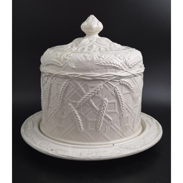 An antique Victorian white ironstone cheese dome and stand, made in Staffordshire, England, and attributed to Ridgway,...