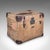 This is an antique travel trunk. An English, canvas and leather gentleman's voyage case with a pair of engraved tankards...