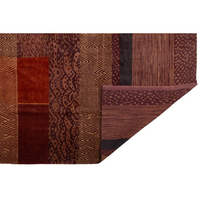 A striking modern Tibetan rug handwoven in Nepal, crafted from a luxurious blend of wool and silk. This piece features a...