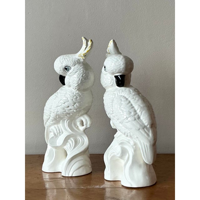 Add a touch of playful sophistication to your decor with this delightful vintage ceramic cockatoo sculpture. Captured in a...