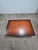 Authentic Polo Ralph Lauren trunk-style coffee table featuring a rich brown finish, extensive decorative nailhead...