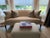 Elegantly upholstered settee featuring a curved back, sloping arms and a generous single bench cushion. Upholstered in a...