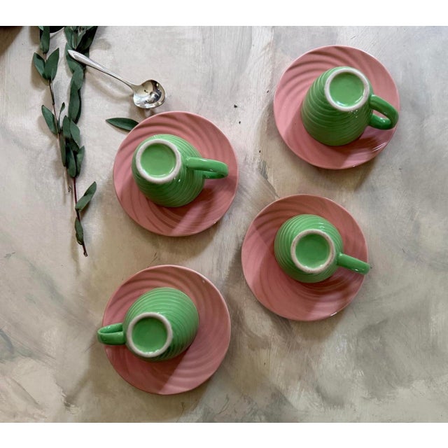 Charming set of 4 cups and saucers, presented in a lime green with a watermelon pink interior of the cup. These have a...