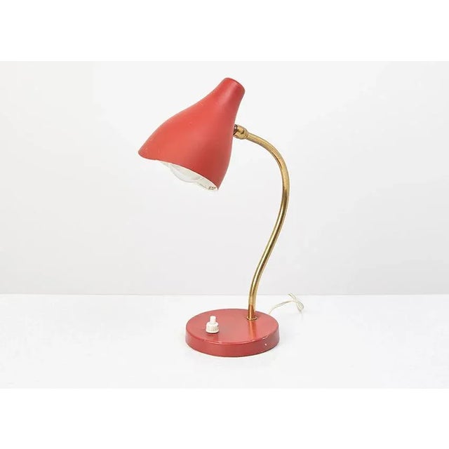 - Table lamp manufactured by Stilux Milano - Red metal shade and base and curved brass stand - The shade can be turned in...