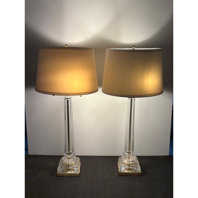Offered for your consideration, A pair of mid-century glass column lamps with brass mounts. Quality craftsmanship with a...