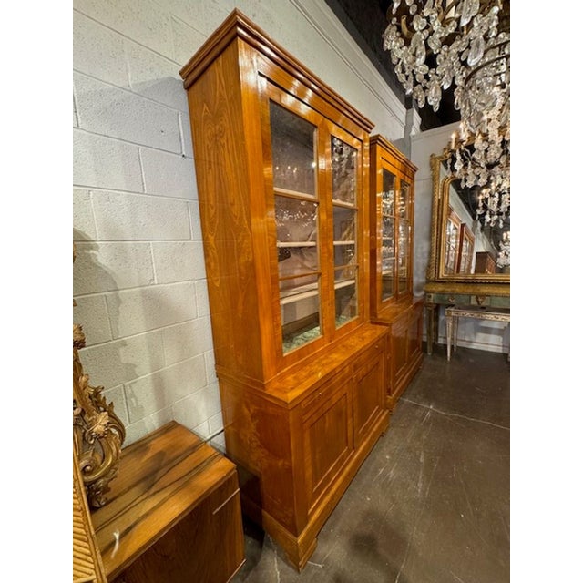 These Antique Italian Maple Transitional Style Bookcases are elegant and timeless pieces of furniture that add a touch of...