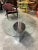 Coffee table, model Lunario, featuring a chromed metal base and an oval glass top 150cm long attached to the base. I have...