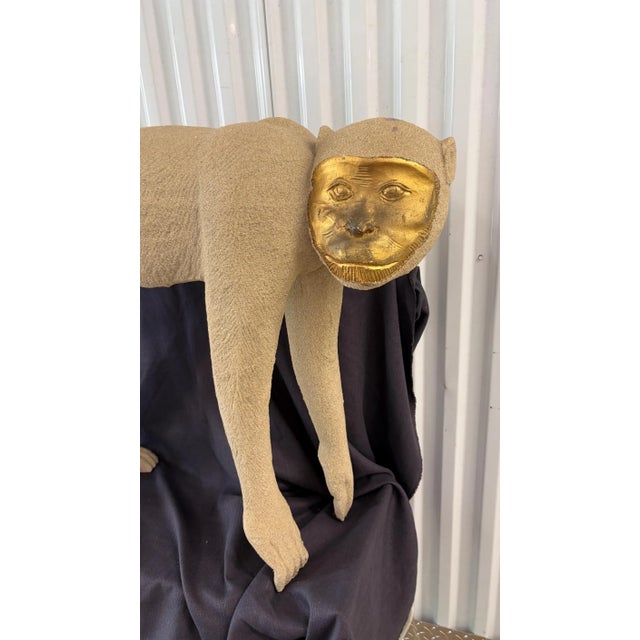 This is a life size 1980s Crouching Monkey Sculpture, in White/ Cream and Gold. It was created using fiberglass with a...