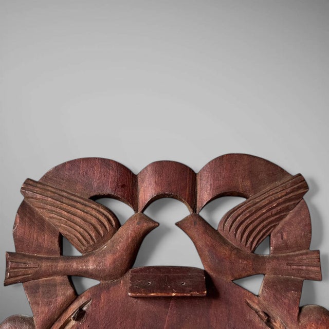 Late 19th C. Courting Mirror This hand-carved courting mirror is made out of white pine, with lovebirds atop a horseshoe...