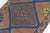 This is a vintage Turkish Oushak rug from the Mid 20th Century. The piece was hand-knotted.