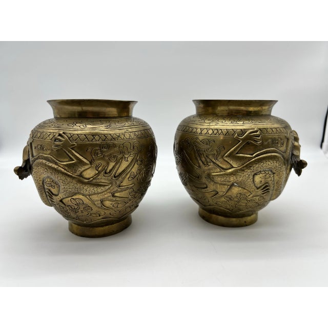 A Very Nice Pair of Antique Chinese Cast Brass Vases, Circa 1900 Made in China, circa 1900 Cast brass, with tooled...