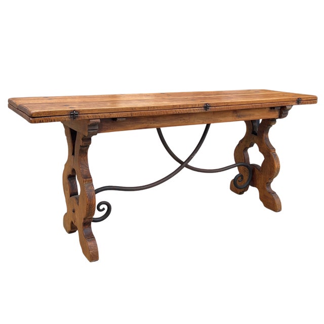 Circa 19th century Spain. Crafted in the Spanish Baroque style, this versatile oak flip top table easily transitions from...