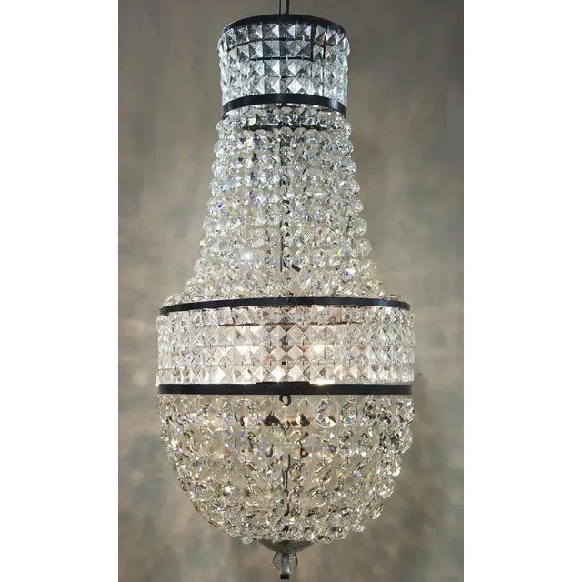 Art Deco inspired but still very, very contemporary, the handcrafted Anna chandelier features cascading glass crystals...