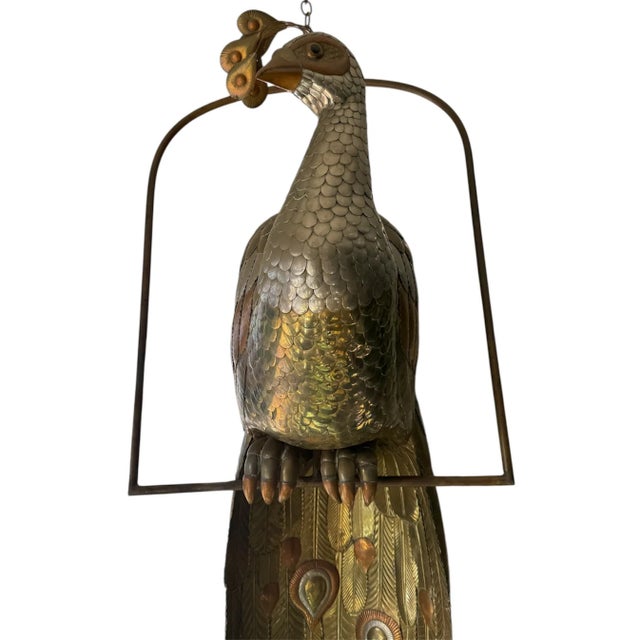 Brass & Pewter Patinated Hanging Peacock Sculpture by Sergio Bustamante. Made in Mexico in 1984. Includes proof of...