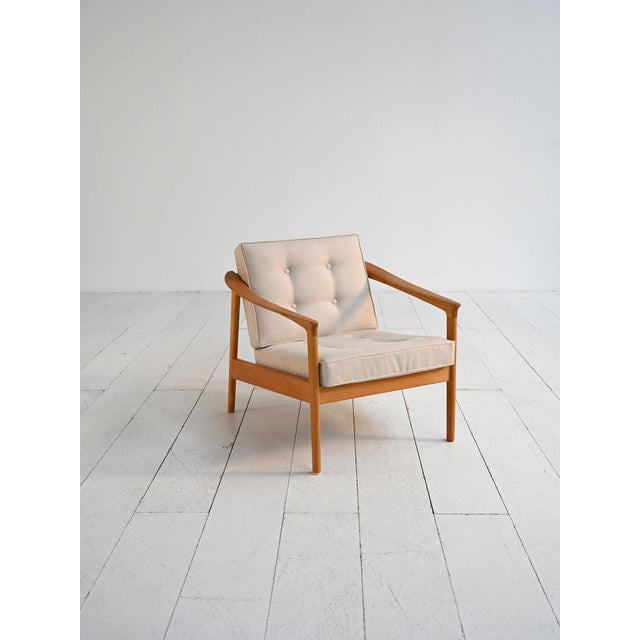 "Monterey" armchair designed by Folke Ohlsson and produced by Bodafors in 1962. Oak frame and reupholstered cushions....