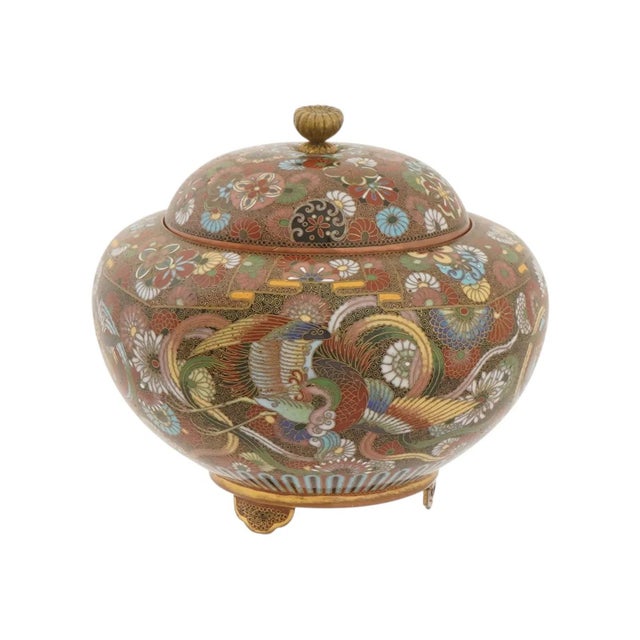 A richly decorated Japanese cloisonné enamel covered jar dating to the Meiji period, showcasing a vibrant and highly...