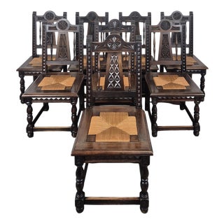 Breton Carved Chairs with Straw Seats, Set of 8 For Sale