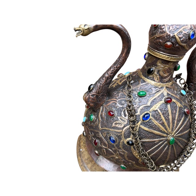 There are objects that were never meant to simply hold liquid. They were meant to hold authority. This hand-crafted brass...