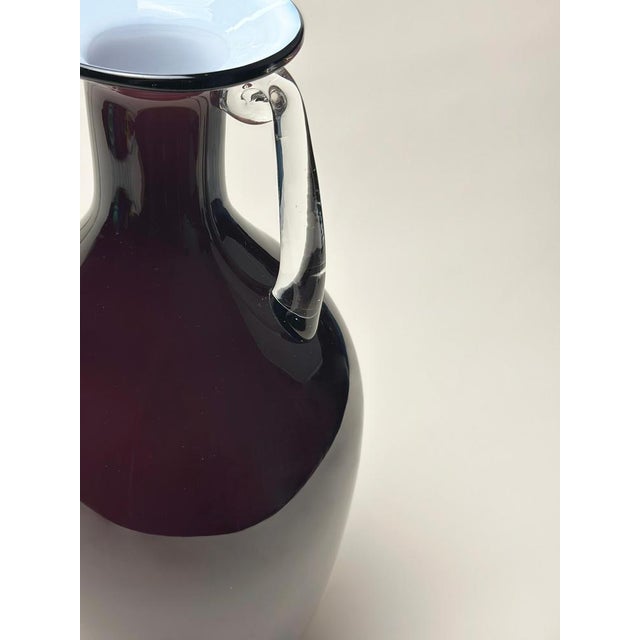 A bold and sculptural cased glass vase designed by Jerzy Słuczan-Orkusz and produced by Tarnowiec Glassworks, Poland,...