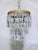 A touch of mid-century glamour and timeless sophistication to your interior with this elegant vintage tiered crystal...