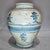 A charming antique Chinese hand-thrown ceramic jar decorated with hand-painted cobalt blue calligraphy characters and...
