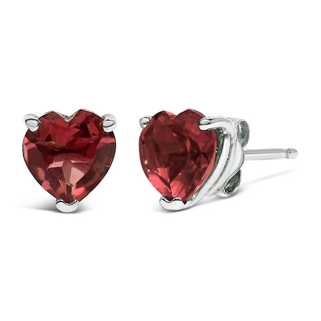 Discover the quintessence of elegance with these heart-shaped red garnet stud earrings, exquisitely cradled in 14K white...