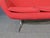 Vibrant Mid-Century Modern settee in the style of Overman, pairing bright red upholstery with a chrome frame. This vintage...