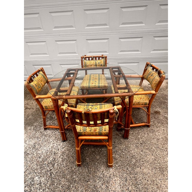 Vintage dining set in great vintage condition. The armchairs have brass tips. Each chair is accented by vibrant yellow...