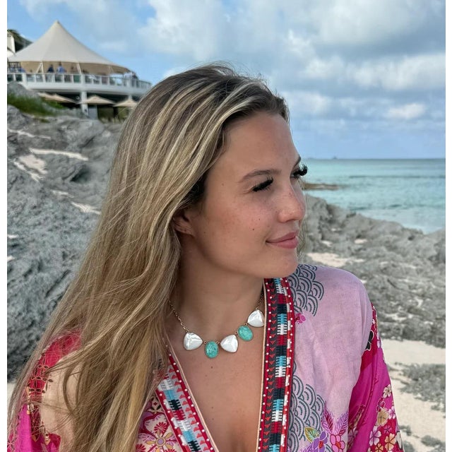 We love the combo of turquoise and pearl. This unique pyramid cut of pearl adds an interesting dimension. Adjustable length