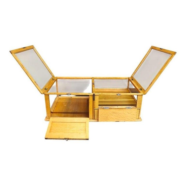 This exceptional antique country store display case, crafted by the renowned Waddell Wooden Ware Works of Greenfield,...