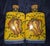 This image shows a pair of hand-painted ceramic cruets, typically used as a matching set for serving olive oil and...