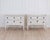 A beautifully balanced pair of 20th century Italian neoclassical commodes, distinguished by their softly bowed fronts,...