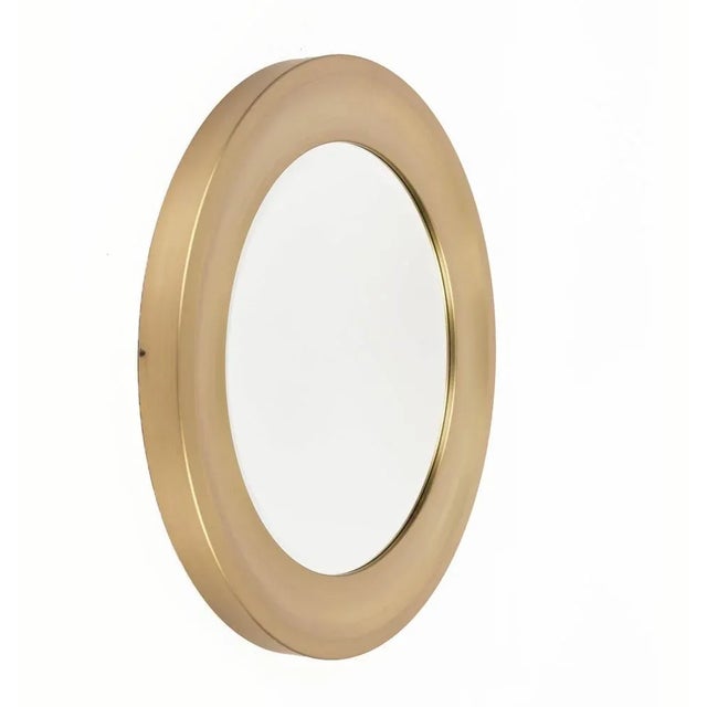Amazing Mid-Century gilded aluminum frame round bevel mirror. This item is attributed to Sergio Mazza for Artemide in...
