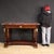 Italian console table from the late 19th century. Empire-style furniture, carved and veneered in high-quality mahogany....