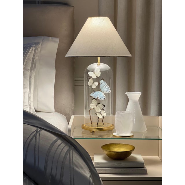 This is a one of a kind, hand made cloche lamp with real butterflies inside. The base is made of wood, gold leafed with...