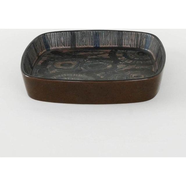 A bowl manufactured in the 1970s by the renowned Danish manufacturer Royal Copenhagen. Designed by Nils Thorsson. Ceramic...