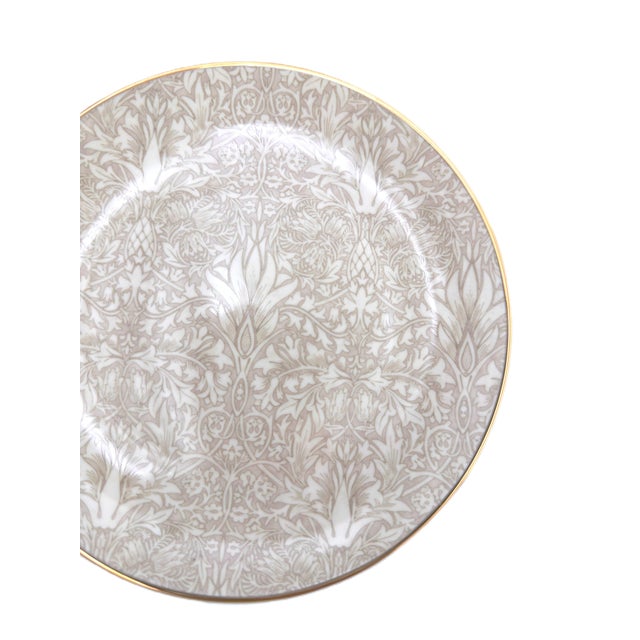 A beautifully curated set of four Morris & Co. “Strawberry Thief” dessert plates, featuring a mixed colorway with two...