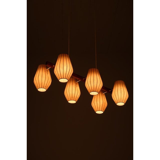 A stunning and rare ceiling lamp designed by Hans Bergström in the 1950s with a refined combination of materials: a teak...