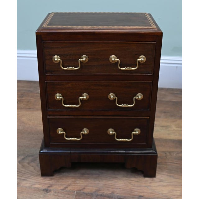 A handsome pair of Victorian bedside chests dating to circa 1890. Each chest has three drawers fitted with brass drop...