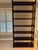 A pair seven shelf bookcases with a bamboo motif in a dark wood standard finish