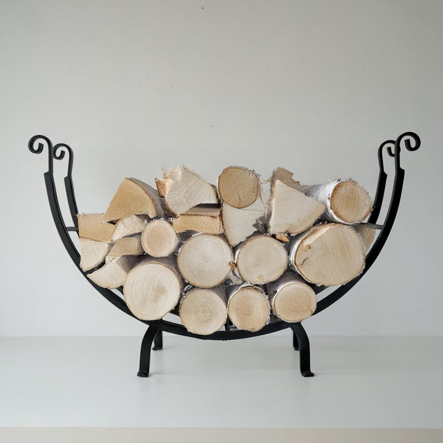 Vintage circa 1990s firewood log holder forged in black coated wrought iron. Scroll end details and wide opening to make...