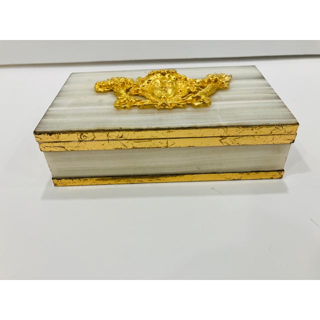 This French onyx box is marked “Made in France” The gold plated cartouche represents Bacchus god of wine The metal frame...