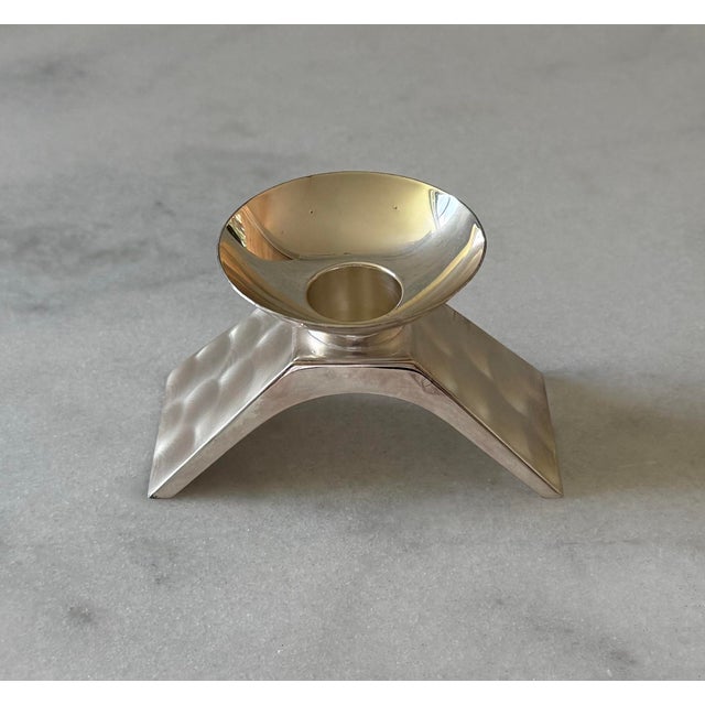 Vintage silver plated candle holder circa 1960s featuring a modernist wedge-shaped base with diamond reflective finish and...