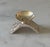 Vintage silver plated candle holder circa 1960s featuring a modernist wedge-shaped base with diamond reflective finish and...