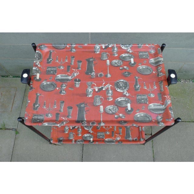 Early type of the original Dinett by Bremshey & co. This model comes with imprints of tin tablewear on the pagwood trays....